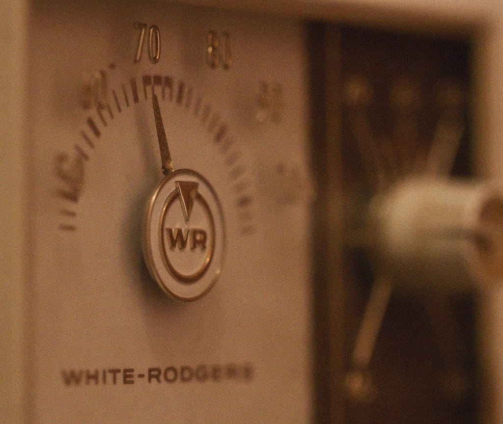 adjusting the thermostat