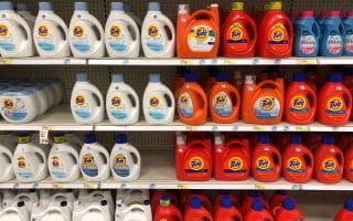 Photograph of laundry detergent on a shelf- indicative of savings.
