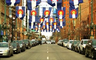 Colorado flags over Denver street.
