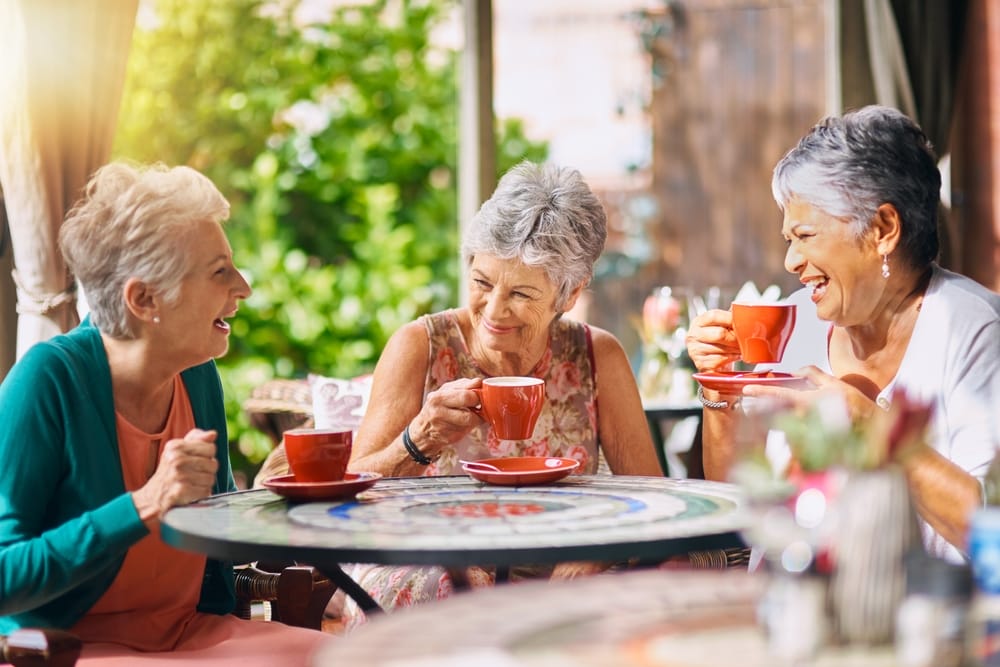 Women enjoying coffee and a lively conversation.