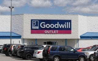 Goodwill location with cars in front of it.