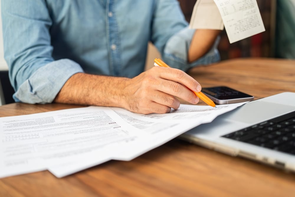 senior calculating IRS tax deductions